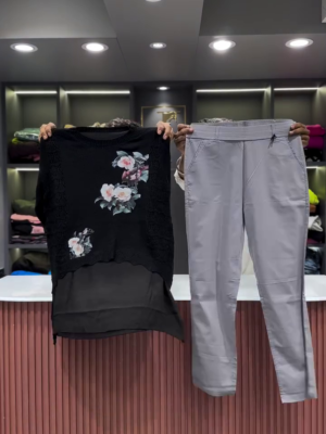 Black Open-Knit Top with Floral Appliqués and Gray Pants